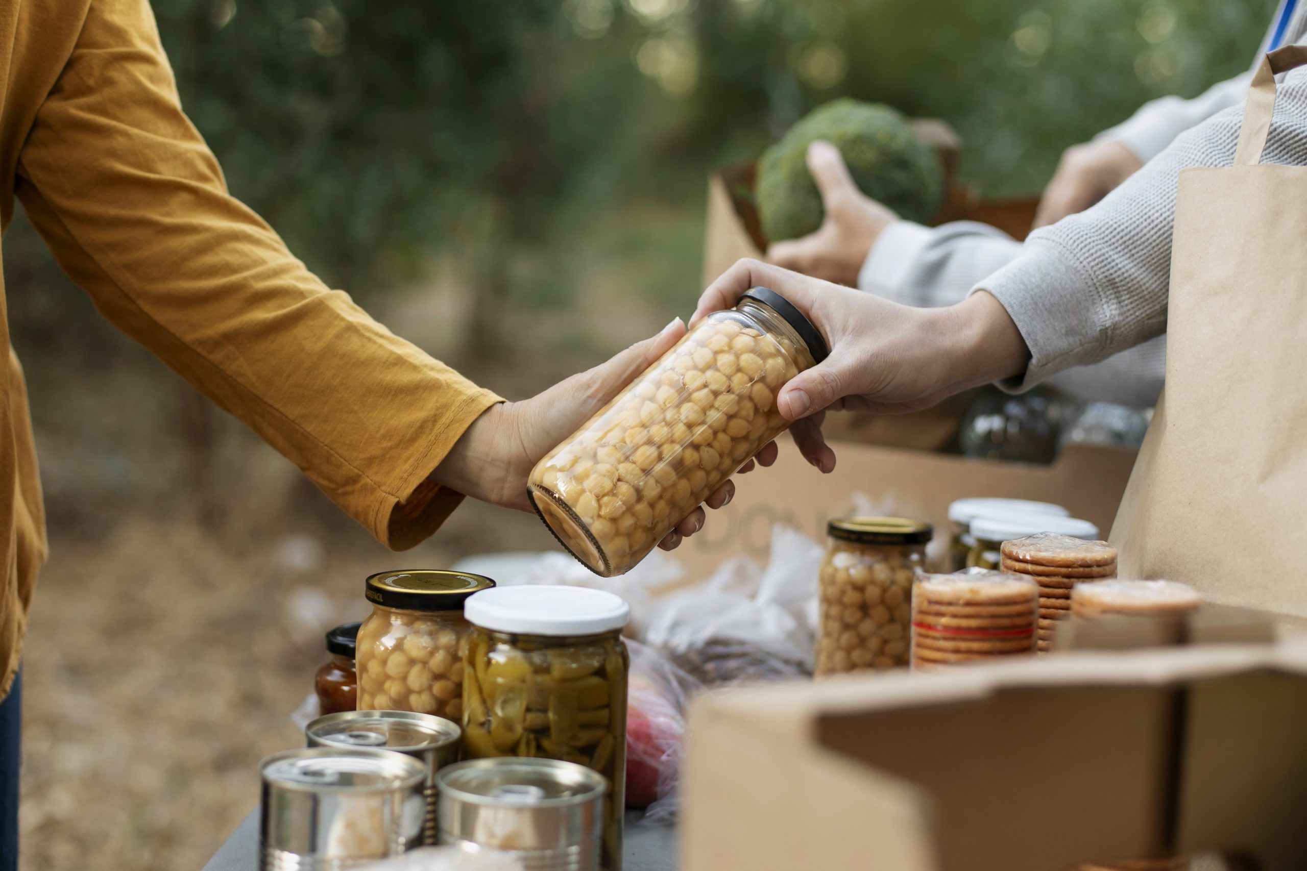 close-up-hands-holding-food-jar Family Strength Food & Meat Bundle - Image 1